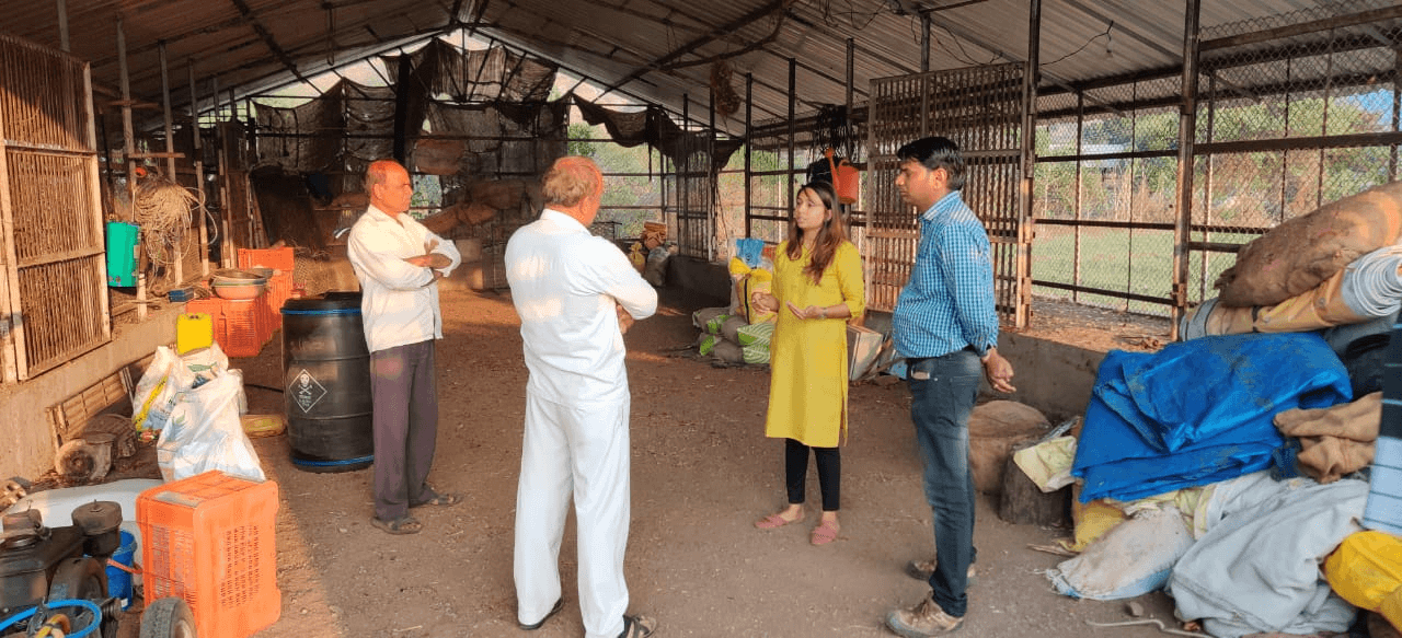 Kalyani Shinde working with farmers in an onion storage facility